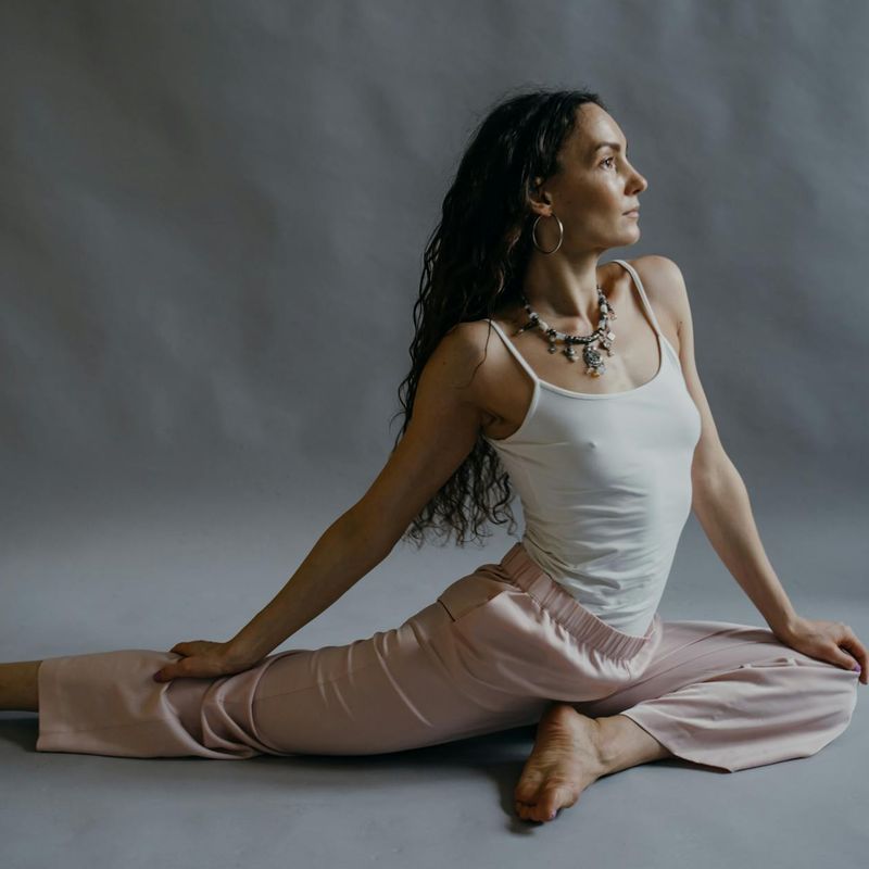 Person demonstrating flexibility and inner balance during a workout session.